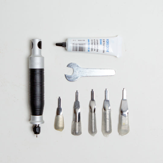 The $125 grafting kit add-on includes:  H.50 chisel handpiece provides hammering action not rotary chiseling. 5 piece chisel set includes 5 large chisels, chisel lubricant and wrench.