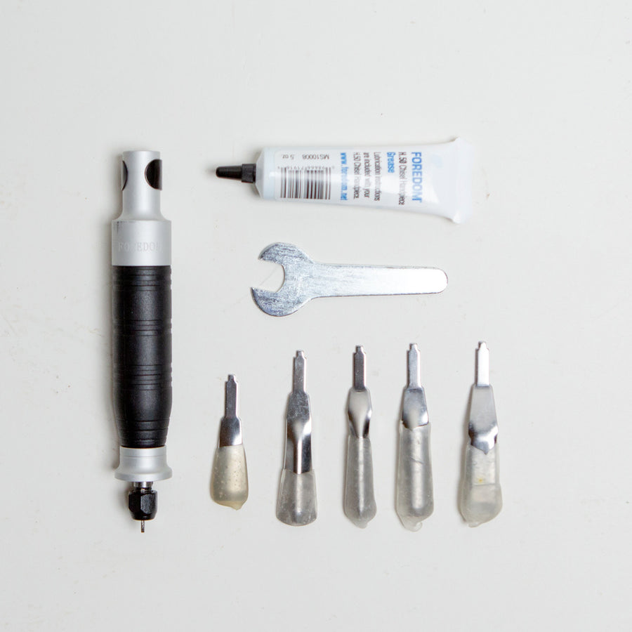The $125 grafting kit add-on includes:  H.50 chisel handpiece provides hammering action not rotary chiseling. 5 piece chisel set includes 5 large chisels, chisel lubricant and wrench. 